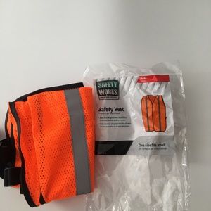 Brand new orange safety vest and construction hat